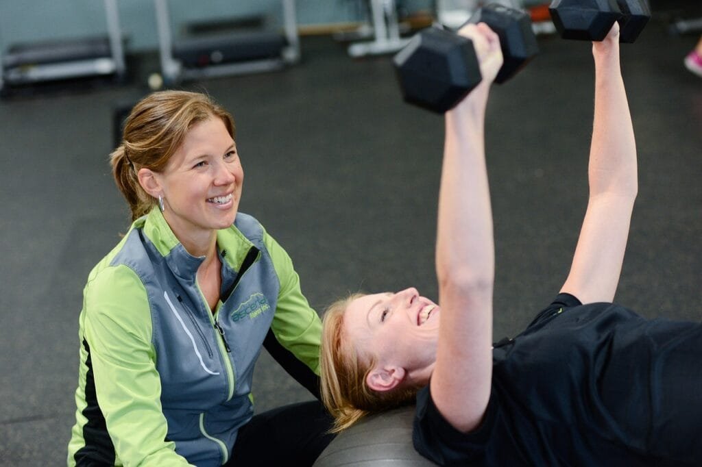 A StretchMasters® therapist assists a patient with an assisted stretching routine