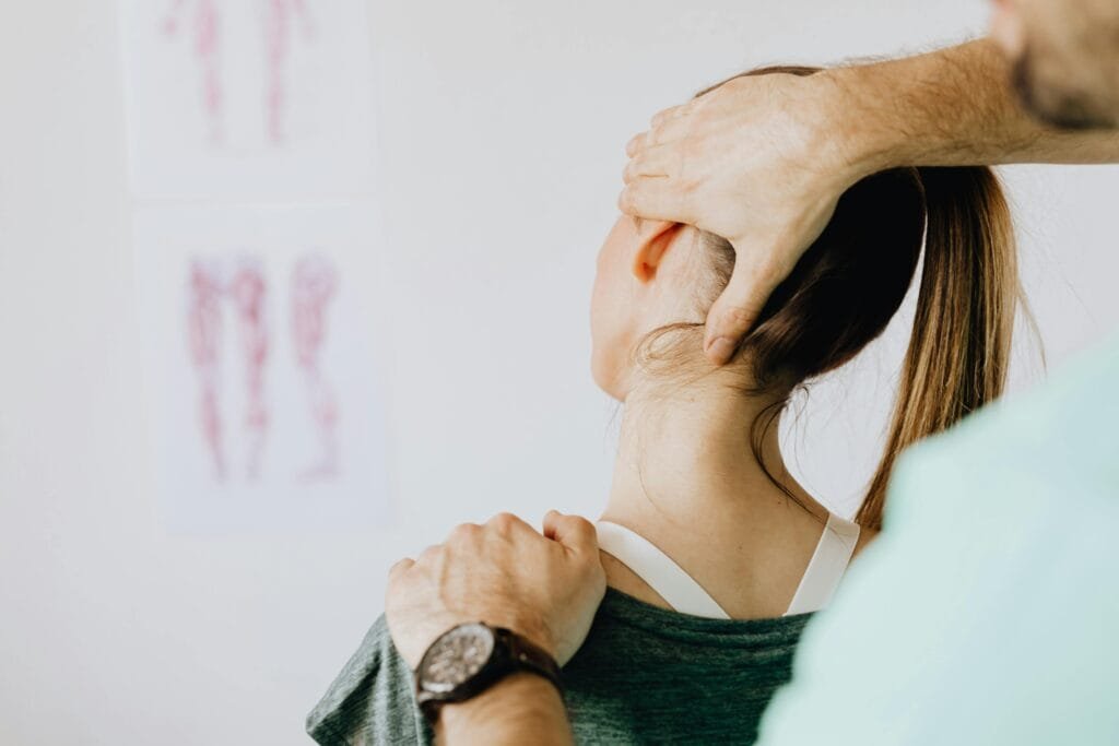 A StretchMasters® therapist assists a patient with an assisted stretching routine