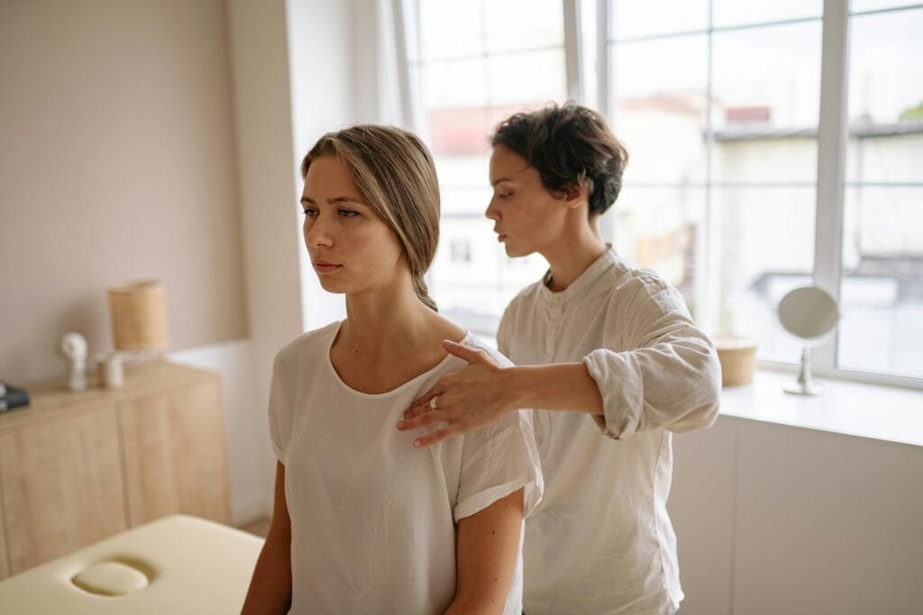 A StretchMasters® therapist assists a patient with an assisted stretching routine