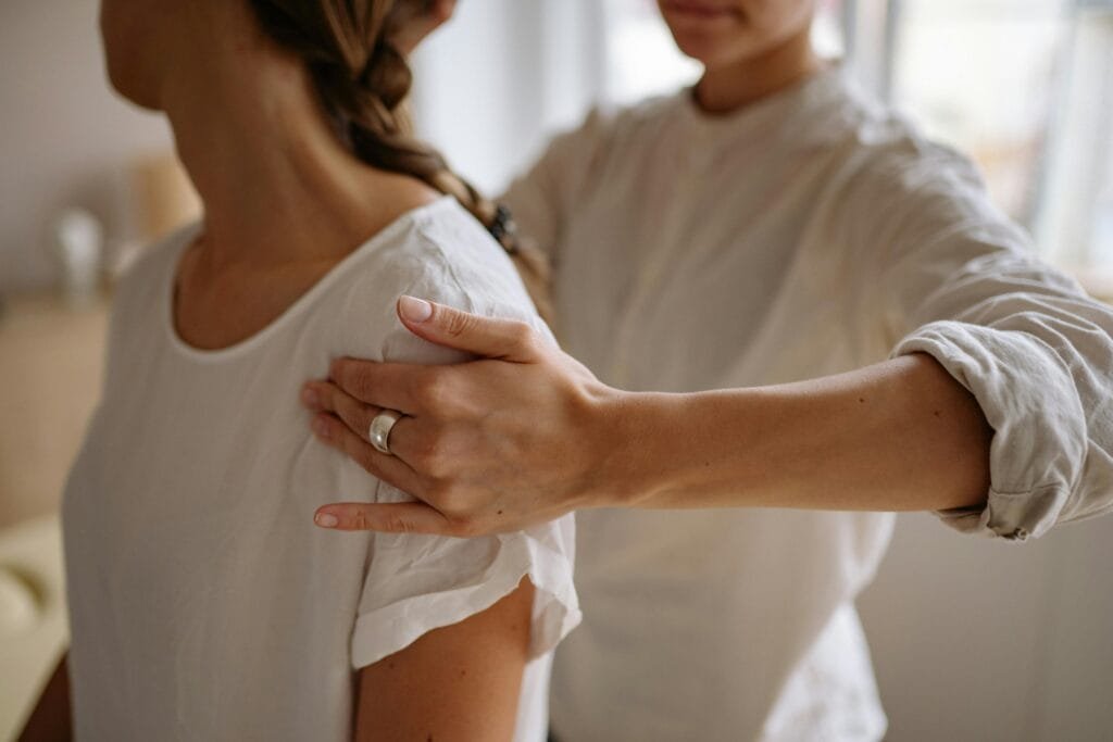 A StretchMasters® therapist assists a patient with an assisted stretching routine