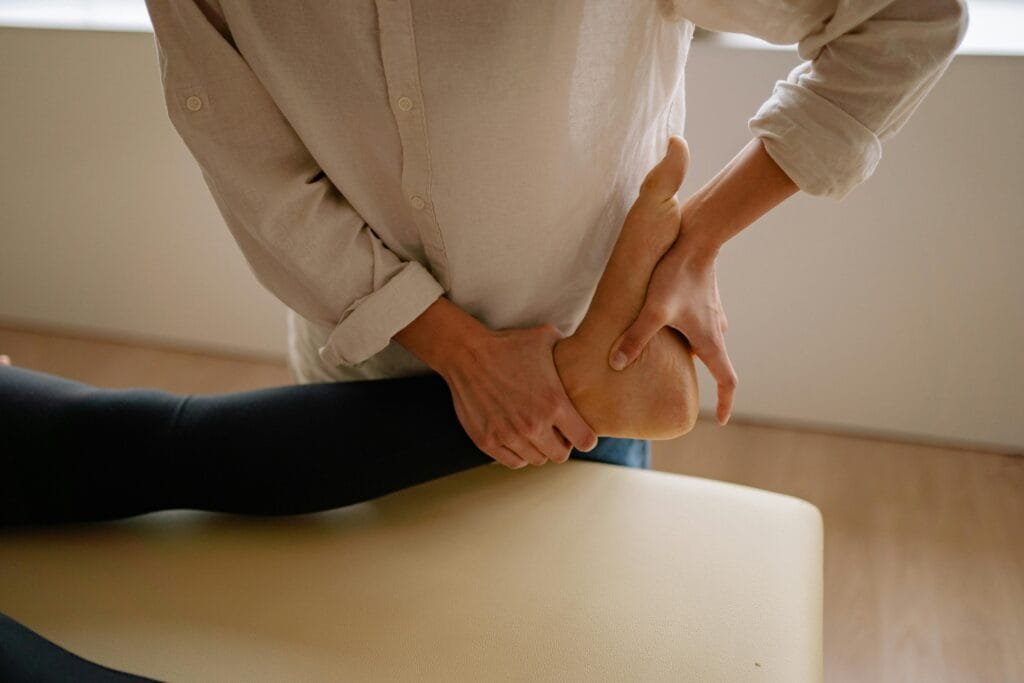 A StretchMasters® therapist assists a patient with an assisted stretching routine