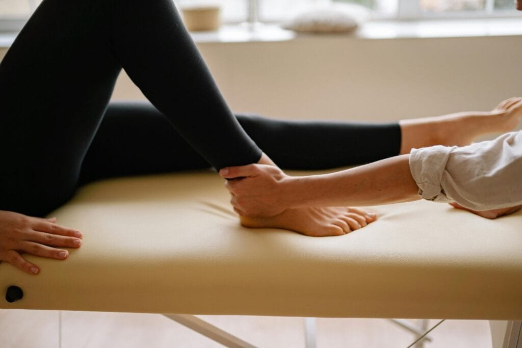 A StretchMasters® therapist assists a patient with an assisted stretching routine