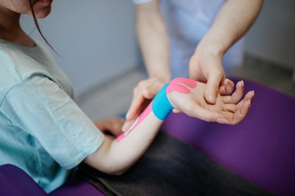 A StretchMasters® therapist assists a patient with an assisted stretching routine